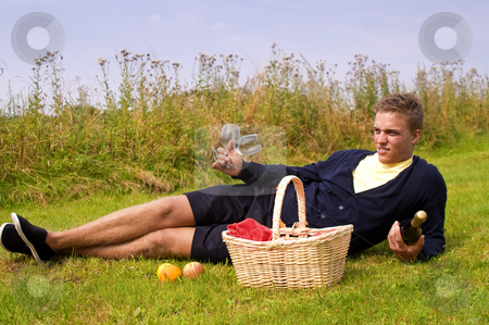 To use this stock image in your creative project, please select the size you need over to the right and click the "Add to Cart" button.
Your downloaded image will come with the Cutcaster watermark removed so don’t worry about the watermark you see on this page. Young man ready for picnic stock photo, Young man laying down in the grass ready for picnic by Karin Claus