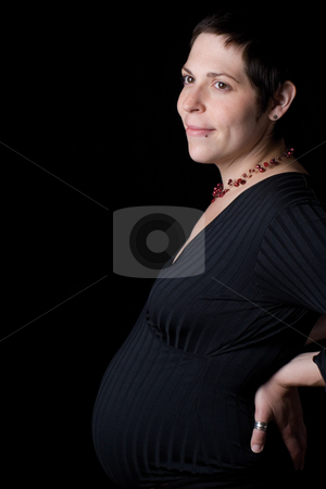 To use this stock image in your creative project, please select the size you need over to the right and click the "Add to Cart" button.
Your downloaded image will come with the Cutcaster watermark removed so don’t worry about the watermark you see on this page. Profile of a pregnant Women stock photo, Profile portrait of a late twenty pregnant women with head turn toward the camera by Yann Poirier