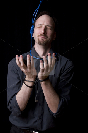 To use this stock image in your creative project, please select the size you need over to the right and click the "Add to Cart" button.
Your downloaded image will come with the Cutcaster watermark removed so don’t worry about the watermark you see on this page. Suicidal technician stock photo, Computer technician with tied hands and hangman noeuce around his neck, pleading for mercy by Yann Poirier