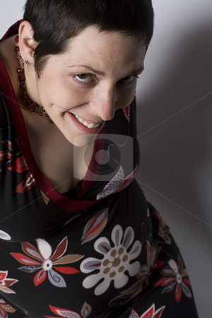 To use this stock image in your creative project, please select the size you need over to the right and click the "Add to Cart" button.
Your downloaded image will come with the Cutcaster watermark removed so don’t worry about the watermark you see on this page. Boyish pregnant women looking naughty stock photo, Late twenties pregnant women with boyish look on white seamless sitting on ground level looking naughty by Yann Poirier