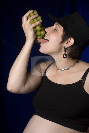 To use this stock image in your creative project, please select the size you need over to the right and click the "Add to Cart" button.
Your downloaded image will come with the Cutcaster watermark removed so don’t worry about the watermark you see on this page. Eating grapes stock photo, Twenty something women in boyish look eating green grapes by Yann Poirier