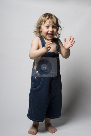 To use this stock image in your creative project, please select the size you need over to the right and click the "Add to Cart" button.
Your downloaded image will come with the Cutcaster watermark removed so don’t worry about the watermark you see on this page. Toddle in overall clapping stock photo, Two year old toddler wearing a jean overall clapping to a beat by Yann Poirier