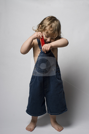 To use this stock image in your creative project, please select the size you need over to the right and click the "Add to Cart" button.
Your downloaded image will come with the Cutcaster watermark removed so don’t worry about the watermark you see on this page. Toddle in overall and his harmonica stock photo, Two year old toddler putting aways his harmonica in his jean overall by Yann Poirier