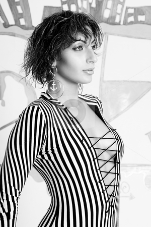 To use this stock image in your creative project, please select the size you need over to the right and click the "Add to Cart" button.
Your downloaded image will come with the Cutcaster watermark removed so don’t worry about the watermark you see on this page. Graffiti fashion model stock photo, Close up protrait of a twenty something libanese fashion model in front of hip hop inspired graffiti by Yann Poirier