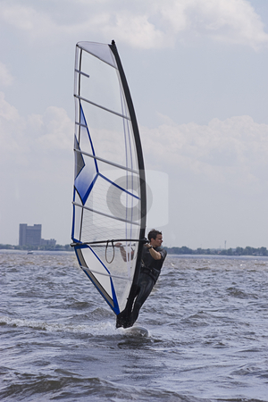 To use this stock image in your creative project, please select the size you need over to the right and click the "Add to Cart" button.
Your downloaded image will come with the Cutcaster watermark removed so don’t worry about the watermark you see on this page. Windsurfer stock photo, Male windsurfer gliding on the St-Laurent River by Yann Poirier