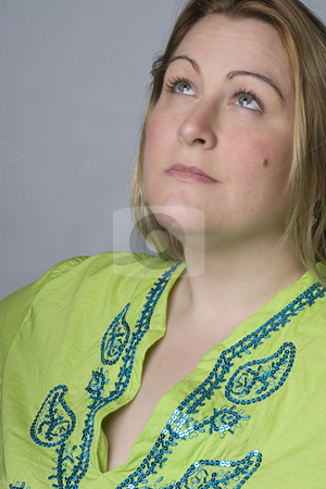 To use this stock image in your creative project, please select the size you need over to the right and click the "Add to Cart" button.
Your downloaded image will come with the Cutcaster watermark removed so don’t worry about the watermark you see on this page. Full figure women stock photo, Portrait of a thirty something overweight women in casual clothes looking up by Yann Poirier