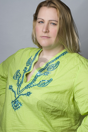 To use this stock image in your creative project, please select the size you need over to the right and click the "Add to Cart" button.
Your downloaded image will come with the Cutcaster watermark removed so don’t worry about the watermark you see on this page. Overweight women in wrinkle shirt stock photo, Full figure women in casual clothes by Yann Poirier