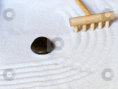 To use this stock image in your creative project, please select the size you need over to the right and click the "Add to Cart" button.
Your downloaded image will come with the Cutcaster watermark removed so don’t worry about the watermark you see on this page. Japanese zen garden stock photo, Close-up of a a Japanese zen garden with a wooden rake and a black stone. by FEL Yannick