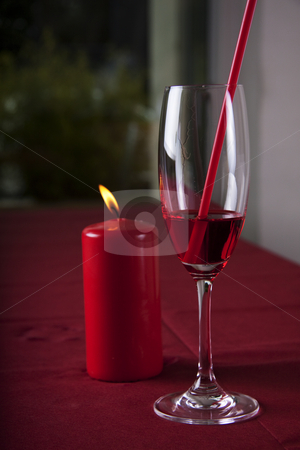To use this stock image in your creative project, please select the size you need over to the right and click the "Add to Cart" button.
Your downloaded image will come with the Cutcaster watermark removed so don’t worry about the watermark you see on this page. Red cocktail and candle stock photo, Red cocktail in a glass with a straw and a red candle in the background by Daniel Kafer