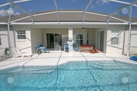 To use this stock image in your creative project, please select the size you need over to the right and click the "Add to Cart" button.
Your downloaded image will come with the Cutcaster watermark removed so don’t worry about the watermark you see on this page. Pool and Lanai stock photo, A Swimming Pool and Lanai in Florida. by Lucy Clark