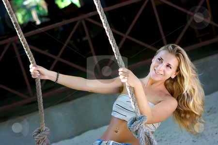 To use this stock image in your creative project, please select the size you need over to the right and click the "Add to Cart" button.
Your downloaded image will come with the Cutcaster watermark removed so don’t worry about the watermark you see on this page. Lady on swings stock photo, Blonde lady swinging on rope swings on the beach by Dmitry Rostovtsev