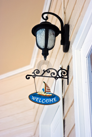 To use this stock image in your creative project, please select the size you need over to the right and click the "Add to Cart" button.
Your downloaded image will come with the Cutcaster watermark removed so don’t worry about the watermark you see on this page. Welcome sign stock photo, Decorative welcome sign at the house entrance by Dmitry Rostovtsev