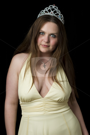 To use this stock image in your creative project, please select the size you need over to the right and click the "Add to Cart" button.
Your downloaded image will come with the Cutcaster watermark removed so don’t worry about the watermark you see on this page. Prom queen stock photo, Prom queen in yellow evening dress with v shape cleavage line by Yann Poirier