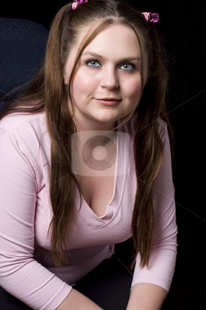 To use this stock image in your creative project, please select the size you need over to the right and click the "Add to Cart" button.
Your downloaded image will come with the Cutcaster watermark removed so don’t worry about the watermark you see on this page. Girl in pink shirt smiling stock photo, Chubby girl in pink shirt smiling by Yann Poirier