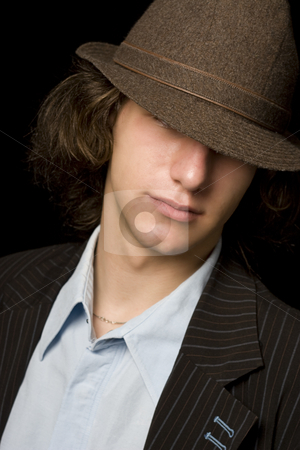 To use this stock image in your creative project, please select the size you need over to the right and click the "Add to Cart" button.
Your downloaded image will come with the Cutcaster watermark removed so don’t worry about the watermark you see on this page. Teen with hat stock photo, Male teenager with a hat tipped over the eyes by Yann Poirier