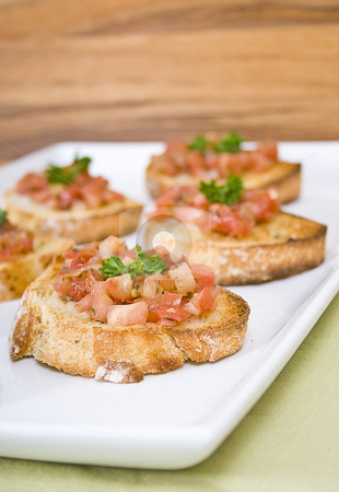 To use this stock image in your creative project, please select the size you need over to the right and click the "Add to Cart" button.
Your downloaded image will come with the Cutcaster watermark removed so don’t worry about the watermark you see on this page. Italian bruschetta on a white serving plate stock photo, Italian bruschetta on a white serving plate by Vincent Demers