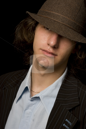 To use this stock image in your creative project, please select the size you need over to the right and click the "Add to Cart" button.
Your downloaded image will come with the Cutcaster watermark removed so don’t worry about the watermark you see on this page. Teen with hat stock photo, Male teenager wearing a suit and hat by Yann Poirier