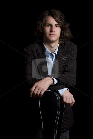 To use this stock image in your creative project, please select the size you need over to the right and click the "Add to Cart" button.
Your downloaded image will come with the Cutcaster watermark removed so don’t worry about the watermark you see on this page. Teen Guitar player stock photo, portrait of a male teenager wearing a suit leaning on a instrument case by Yann Poirier