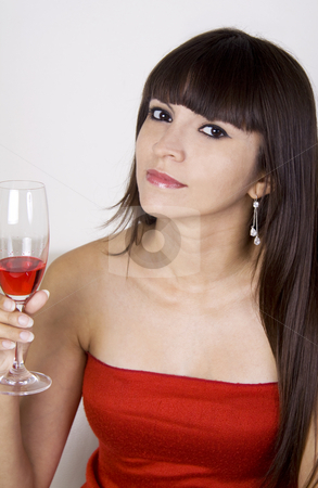 To use this stock image in your creative project, please select the size you need over to the right and click the "Add to Cart" button.
Your downloaded image will come with the Cutcaster watermark removed so don’t worry about the watermark you see on this page. Woman having a drink at a party stock photo, Latina woman in a red dress is having a red drink while sitting on a beige couch by Daniel Kafer