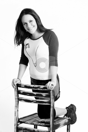 To use this stock image in your creative project, please select the size you need over to the right and click the "Add to Cart" button.
Your downloaded image will come with the Cutcaster watermark removed so don’t worry about the watermark you see on this page. Kneeling on chair stock photo, Yound women with one knee on a chair by Yann Poirier