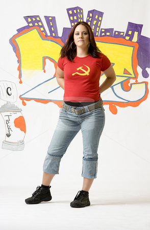 To use this stock image in your creative project, please select the size you need over to the right and click the "Add to Cart" button.
Your downloaded image will come with the Cutcaster watermark removed so don’t worry about the watermark you see on this page. Posing stock photo, Young women stop in a pose in front of a graffiti by Yann Poirier