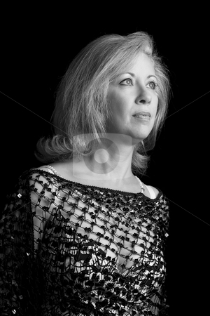 To use this stock image in your creative project, please select the size you need over to the right and click the "Add to Cart" button.
Your downloaded image will come with the Cutcaster watermark removed so don’t worry about the watermark you see on this page. Women in her fifties in black and white stock photo, Portrait of a women in her fifties in black and white by Yann Poirier
