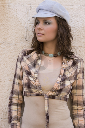To use this stock image in your creative project, please select the size you need over to the right and click the "Add to Cart" button.
Your downloaded image will come with the Cutcaster watermark removed so don’t worry about the watermark you see on this page. Young women stock photo, Young women with style against painted brick wall by Yann Poirier