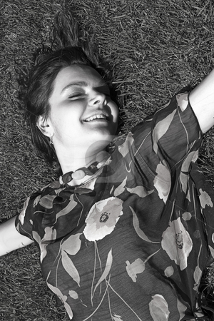To use this stock image in your creative project, please select the size you need over to the right and click the "Add to Cart" button.
Your downloaded image will come with the Cutcaster watermark removed so don’t worry about the watermark you see on this page. Happy to be in the grass stock photo, Teen girl with great big smile and closed eyed laying in grass by Yann Poirier