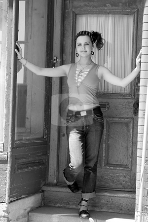To use this stock image in your creative project, please select the size you need over to the right and click the "Add to Cart" button.
Your downloaded image will come with the Cutcaster watermark removed so don’t worry about the watermark you see on this page. Teenager in doorway stock photo, Teenage girl walking out of a doorway by Yann Poirier
