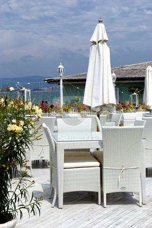 To use this stock image in your creative project, please select the size you need over to the right and click the "Add to Cart" button.
Your downloaded image will come with the Cutcaster watermark removed so don’t worry about the watermark you see on this page. Greek restaurant setting stock photo, Romantic restaurant in greek style by Desislava Dimitrova