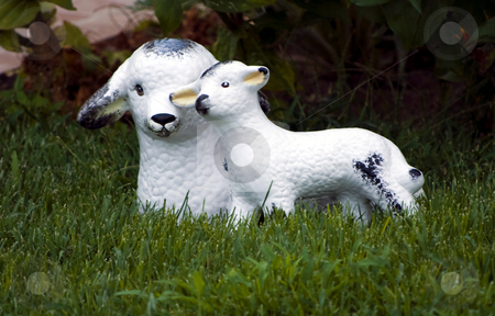 To use this stock image in your creative project, please select the size you need over to the right and click the "Add to Cart" button.
Your downloaded image will come with the Cutcaster watermark removed so don’t worry about the watermark you see on this page. Garden decorative statue stock photo, Little lamb and sheep garden decorative statue on green grass by Desislava Dimitrova