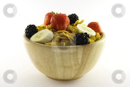 To use this stock image in your creative project, please select the size you need over to the right and click the "Add to Cart" button.
Your downloaded image will come with the Cutcaster watermark removed so don’t worry about the watermark you see on this page. Cornflakes and Fruit in a Wooden Bowl stock photo, Cornflakes with strawberries, blackberries and banana in a round wooden bowl on a white background by Keith Wilson