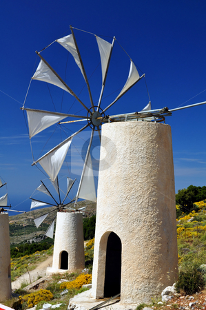 To use this stock image in your creative project, please select the size you need over to the right and click the "Add to Cart" button.
Your downloaded image will come with the Cutcaster watermark removed so don’t worry about the watermark you see on this page. Wind mills in Crete stock photo, Travel photography: traditional wind mills in the Lassithi plateau, Crete. by Fernando Barozza