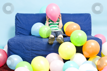 To use this stock image in your creative project, please select the size you need over to the right and click the "Add to Cart" button.
Your downloaded image will come with the Cutcaster watermark removed so don’t worry about the watermark you see on this page. Balloon boy stock photo, Young boy sitting on a couch, hiding behind a baloon he's holding by Corepics VOF
