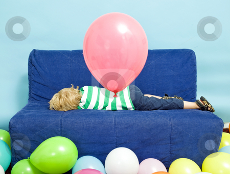 To use this stock image in your creative project, please select the size you need over to the right and click the "Add to Cart" button.
Your downloaded image will come with the Cutcaster watermark removed so don’t worry about the watermark you see on this page. Birthday blues stock photo, Young Boy lying down on a couch on his birthday by Corepics VOF