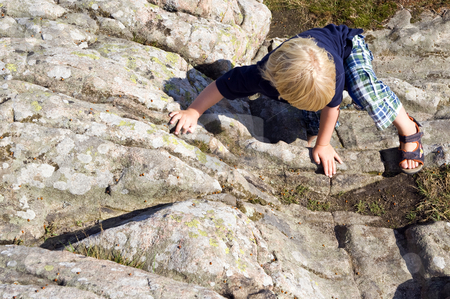 To use this stock image in your creative project, please select the size you need over to the right and click the "Add to Cart" button.
Your downloaded image will come with the Cutcaster watermark removed so don’t worry about the watermark you see on this page. Climbing boy stock photo, Young child, climbing a big rock on using his hands and feet by Corepics VOF