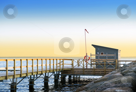 To use this stock image in your creative project, please select the size you need over to the right and click the "Add to Cart" button.
Your downloaded image will come with the Cutcaster watermark removed so don’t worry about the watermark you see on this page. Lifeguard station stock photo, Lifeguard station and pier on a tranquil evening on the south coast of Sweden, looking out towards Danemark by Corepics VOF