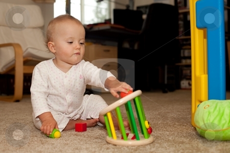 To use this stock image in your creative project, please select the size you need over to the right and click the "Add to Cart" button.
Your downloaded image will come with the Cutcaster watermark removed so don’t worry about the watermark you see on this page. Playing on the floor stock photo, Cute Caucasian baby girl playing on a floor. by Mariusz Jurgielewicz