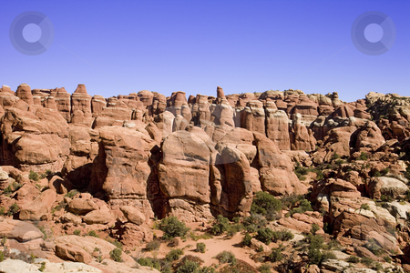 To use this stock image in your creative project, please select the size you need over to the right and click the "Add to Cart" button.
Your downloaded image will come with the Cutcaster watermark removed so don’t worry about the watermark you see on this page. Rock formation stock photo, Hoodoos in the Arches National Park by Sharron Schiefelbein