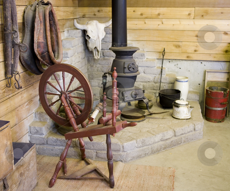 To use this stock image in your creative project, please select the size you need over to the right and click the "Add to Cart" button.
Your downloaded image will come with the Cutcaster watermark removed so don’t worry about the watermark you see on this page. 229 Old spinning wheel stock photo, Spinning wheel, potbelly stove and other antiques by Sharron Schiefelbein