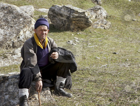 To use this stock image in your creative project, please select the size you need over to the right and click the "Add to Cart" button.
Your downloaded image will come with the Cutcaster watermark removed so don’t worry about the watermark you see on this page. Nomadic sheepherder stock photo, This Normadic sheepherder stops for a rest before moving his sheep down the hill. by Sharron Schiefelbein