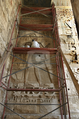 To use this stock image in your creative project, please select the size you need over to the right and click the "Add to Cart" button.
Your downloaded image will come with the Cutcaster watermark removed so don’t worry about the watermark you see on this page. Restoring the wall stock photo, Worker restoring the wall of hieroglyphics in Egypt by Sharron Schiefelbein