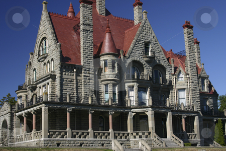 To use this stock image in your creative project, please select the size you need over to the right and click the "Add to Cart" button.
Your downloaded image will come with the Cutcaster watermark removed so don’t worry about the watermark you see on this page. Old house in British Columbia stock photo, Old Castle type house with deep blue sky in background by Sharron Schiefelbein