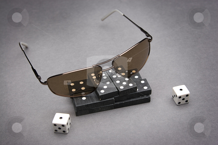 To use this stock image in your creative project, please select the size you need over to the right and click the "Add to Cart" button.
Your downloaded image will come with the Cutcaster watermark removed so don’t worry about the watermark you see on this page. Dominos and snake eye stock photo, Men's sunglasses place on top of a pile of dominos with a pair of dice rolled on snake eyes by Yann Poirier