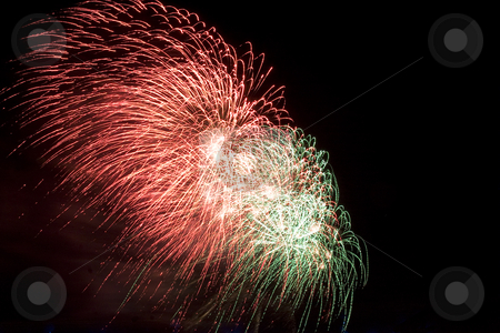 To use this stock image in your creative project, please select the size you need over to the right and click the "Add to Cart" button.
Your downloaded image will come with the Cutcaster watermark removed so don’t worry about the watermark you see on this page. Firework stock photo, Red and green firework display trailing in the wind by Yann Poirier