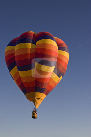 To use this stock image in your creative project, please select the size you need over to the right and click the "Add to Cart" button.
Your downloaded image will come with the Cutcaster watermark removed so don’t worry about the watermark you see on this page. Multi-colored hot air ballon stock photo, Early morning lift off a multi-coloured hot air ballon by Yann Poirier