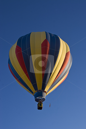 To use this stock image in your creative project, please select the size you need over to the right and click the "Add to Cart" button.
Your downloaded image will come with the Cutcaster watermark removed so don’t worry about the watermark you see on this page. Multi-colored hot air ballon stock photo, Early morning lift off a multi-coloured hot air ballon by Yann Poirier