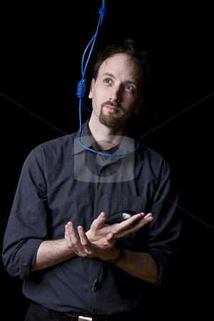 To use this stock image in your creative project, please select the size you need over to the right and click the "Add to Cart" button.
Your downloaded image will come with the Cutcaster watermark removed so don’t worry about the watermark you see on this page. SUICIDAL TECHNICIAN stock photo, Computer technician with tied hands and hangman noeuce done with network blue cable around his neck by Yann Poirier