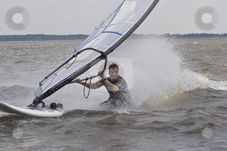 To use this stock image in your creative project, please select the size you need over to the right and click the "Add to Cart" button.
Your downloaded image will come with the Cutcaster watermark removed so don’t worry about the watermark you see on this page. Windsurfer body drag stock photo, Windsurfer doing a body drag trick in the water by Yann Poirier