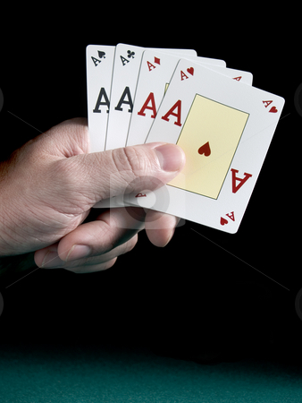 To use this stock image in your creative project, please select the size you need over to the right and click the "Add to Cart" button.
Your downloaded image will come with the Cutcaster watermark removed so don’t worry about the watermark you see on this page. Four aces stock photo, A man's hand holding four aces isolated on black background. by Ignacio Gonzalez Prado